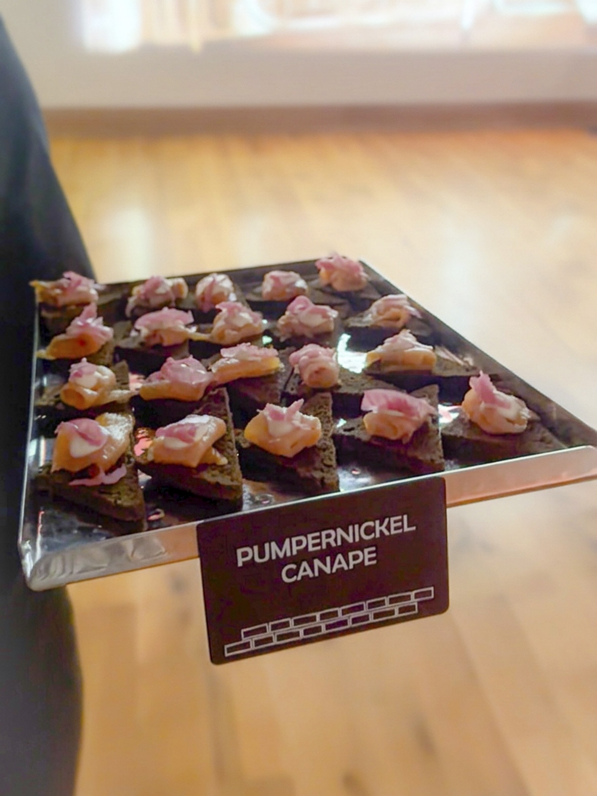 Tray of appetisers highlighted with its label